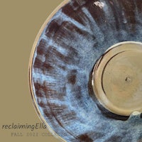 a blue and brown plate with a rim on it